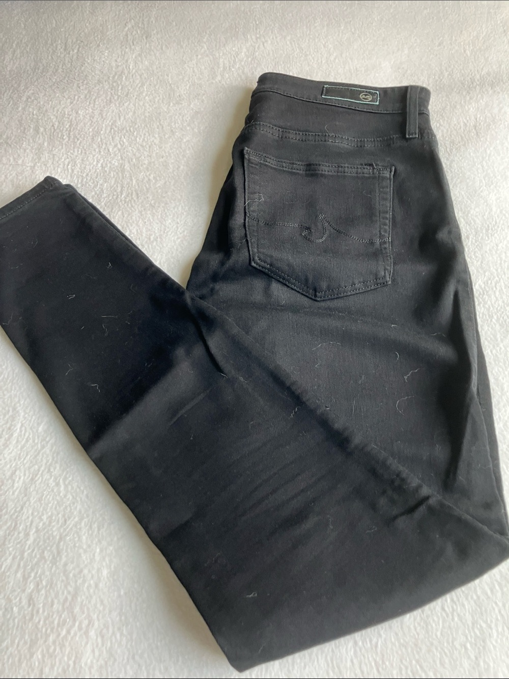 AG Women’s Black Skinny Jeans.